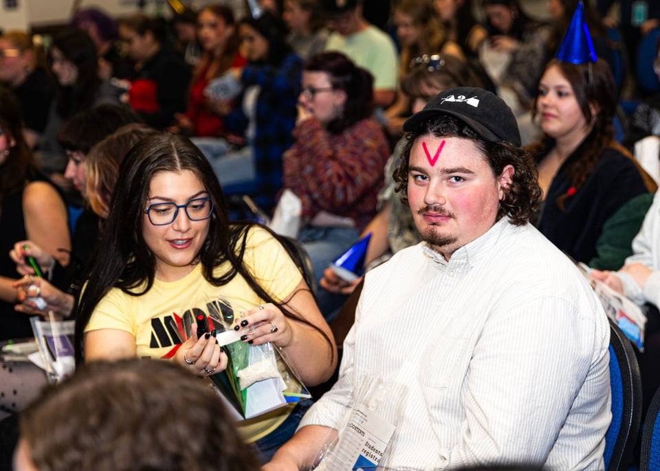 Student with "V" on forhead